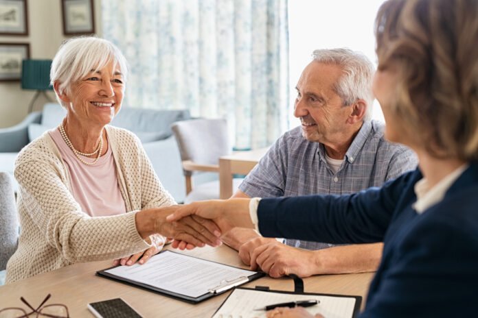 Happy,Old,Woman,Shaking,Hands,With,Medical,Adviser,For,Health Insurance's Hidden Power: Fueling Sustainable Investment Protection