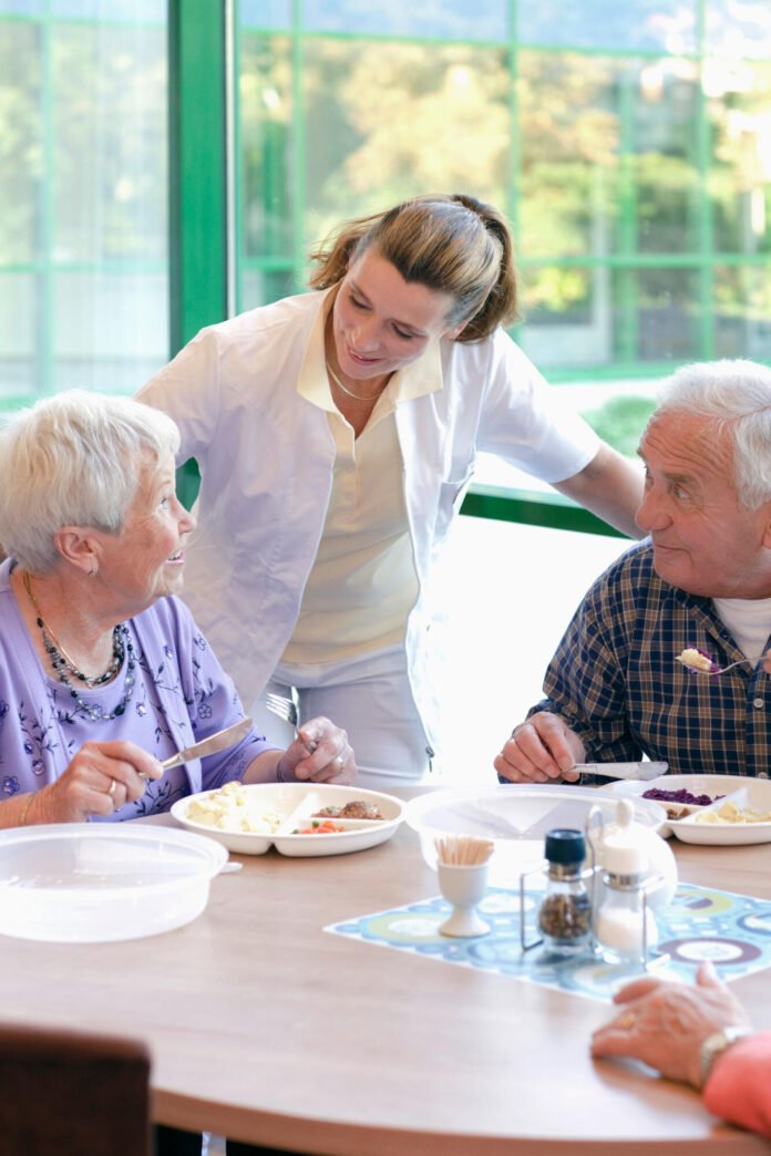 Two,Senior,People,Having,Lunch,In,A,Retirement,Home Exploring Senior Housing Amenities and Features for Families